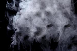 Abstract  powder or smoke isolated on black background photo