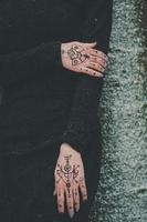 Close up female hands with spiritual tattoos concept photo