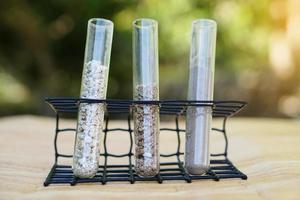 Test tubes that contain sample soil. Concept, soil quality inspection, research and science experiment. Laboratory. Find the best from different soil type and source for growing agriculture crops photo