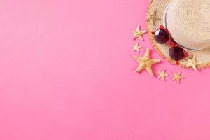 summer holiday beach background with accessories on wooden table, top view with copy space. vacation concept photo