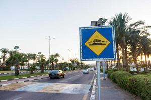 Speed Bump sign on the sunny road in Egypt photo