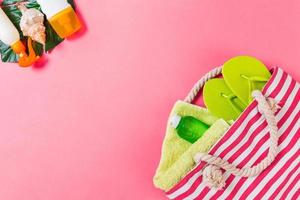 Summer bag background with copy space. Flat lay photo on color table, travel concept. Free space for text, mock-up
