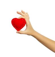 Hand holding a heart isolated on white background