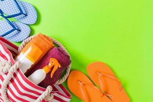 Summer bag background with copy space. Flat lay photo on color table, travel concept. Free space for text, mock-up