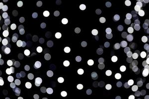 Abstract blur black and white bokeh background. many round light on background photo