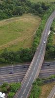 Aerial View of British Roads and Traffic Passing Through City. Drone's Camera Footage in Vertical and Portrait Style video