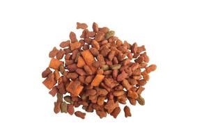 Stack of cat food pellets on white background photo