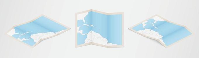 Folded map of Dominica in three different versions. vector