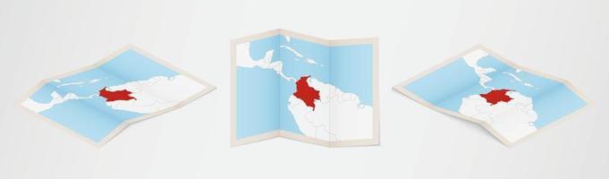 Folded map of Colombia in three different versions. vector