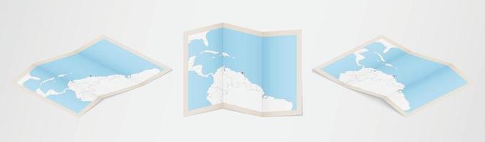 Folded map of Trinidad and Tobago in three different versions. vector