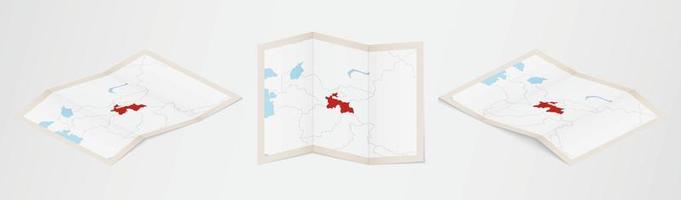 Folded map of Tajikistan in three different versions. vector