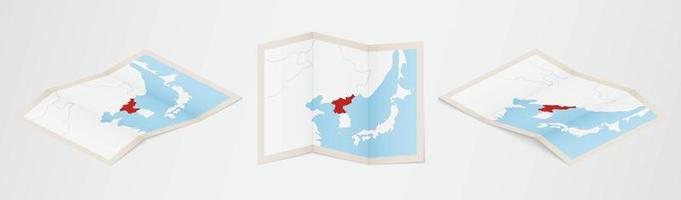 Folded map of North Korea in three different versions. vector
