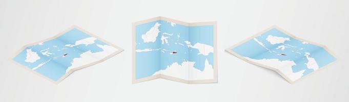 Folded map of East Timor in three different versions. vector