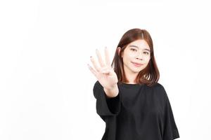 Showing Four count finger of Beautiful Asian Woman Isolated On White Background photo