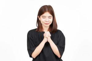 Fold Hand and Pray Of Beautiful Asian Woman Isolated On White Background photo