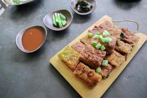 Martabak Telor or Murtabak Telur or mutabbaq. Savory pan-fried pastry stuffed with egg, meat and spices. Martabak Telur is one of Indonesia street food. photo