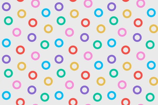 Festive seamless retro pattern with random bright colorful circles. Cute trendy polka dot horizontal background. Abstract geometric banner template with multicolored rings. Design for textile, fabric