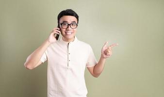 Photo of young Asian man on background