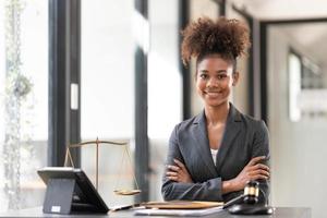 justice and law concept.Male judge in a courtroom on wooden table and Counselor or Portrait asian lawyer working with lsptop in office. Legal law, advice and justice concept photo