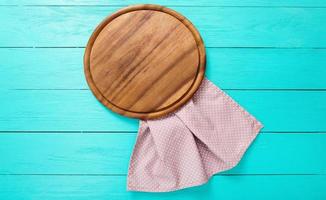 wooden table top view, desk for pizza with coloured napkins. Holiday, food concept photo