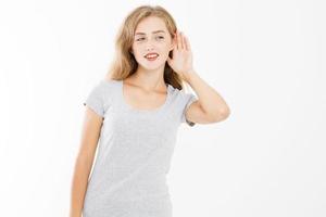 Young girl with interest. Woman listening and overhearing by her ear isolated on white. Template summer t shirt with copy space. photo