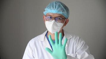 portrait of asian surgeon wave his hand to deny or tell someboey donot do something video