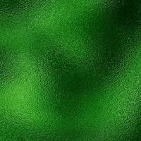 Green metallic foil background texture photo