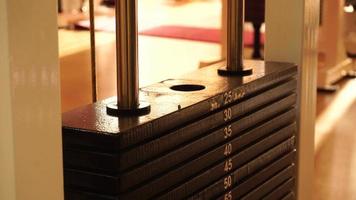 close up of weight stack from a cable exercise machine. Gym and workout equipment for training in 4k. video