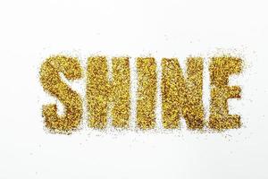 bright sequins text on white background. shine photo