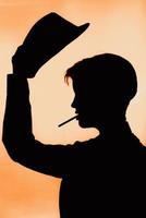 portrait of a silhouette of a girl in a hat with a cigarette. photo with the thrown grain