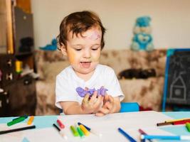 the boy is engaged in modeling from dough for modeling figures photo