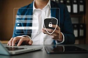 Cyber security concept, Login, User, identification information security and encryption, secure access to user's personal information woman using smart phone and tablet in office photo
