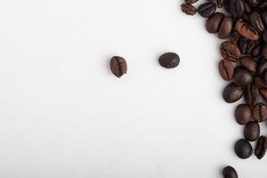 coffee beans border isolated on white background with copy space photo