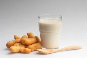 Soy milk and Patongo on white background photo