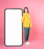 Image of young Asian businesswoman with smartphone mock up photo