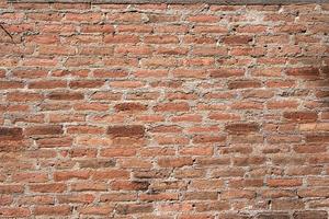 abstract orange square brick block on cement wall textured and background. strong interiors house building image photo