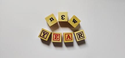 New year word in wooden cubes concept photo