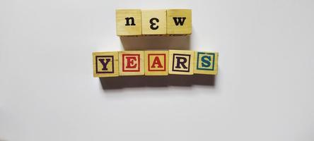 New years word in wooden cubes concept photo