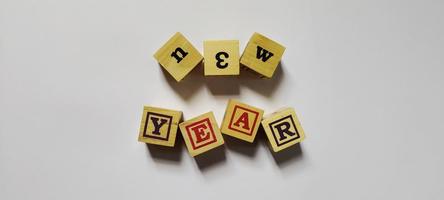 New year word in wooden cubes concept photo