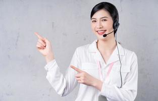 Portrait of young Asian operator on background photo