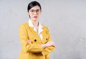 Portrait of young Asian businesswoman on background photo