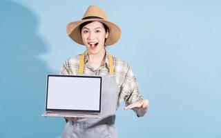 Portrait of young Asian female farmer photo