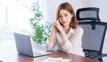 Portrait of young Asian businesswoman working photo