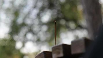 a stick of incense is smoking video