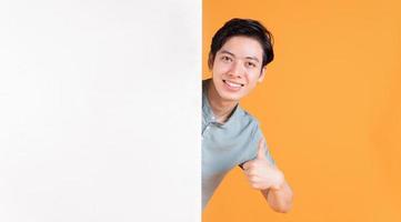 Portrait of young Asian man on background photo