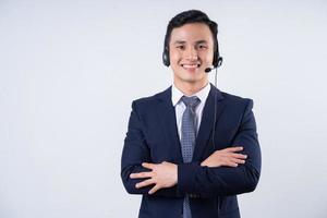 Image of young Asian businessman on background photo