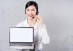 Portrait of young Asian operator on background photo