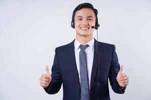 Image of young Asian businessman on background photo