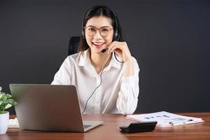 Image of young Asian businesswoman working at office photo