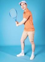 Image of young Asian man holding tennis racket photo